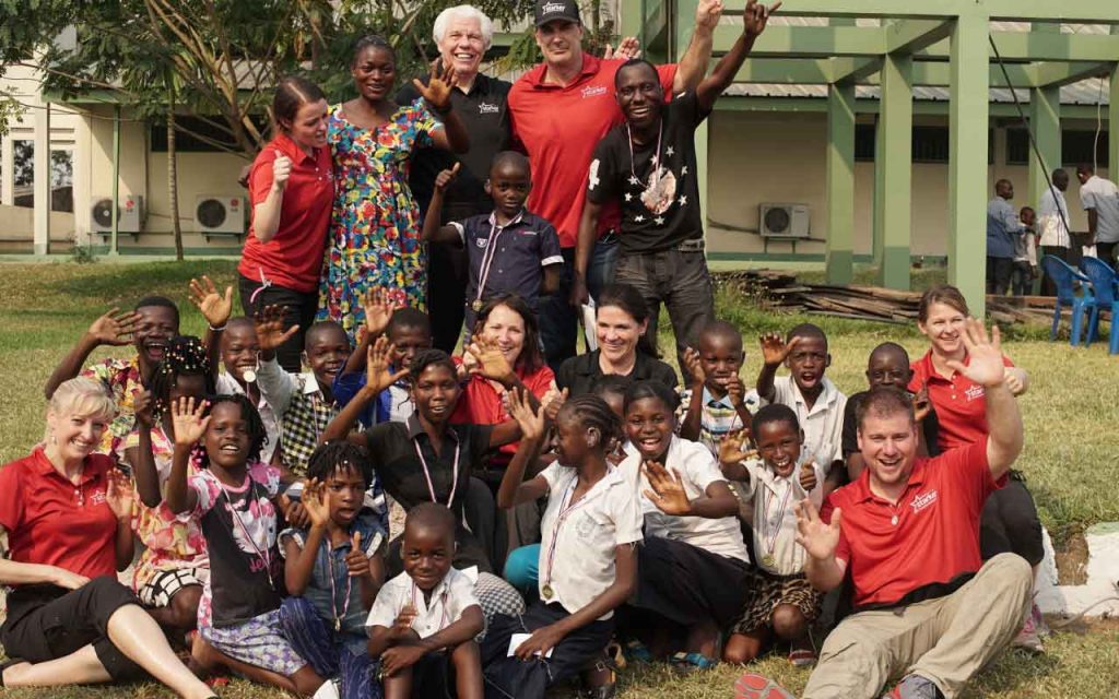 Group of people on a trip to the Congo to help with hearing aids