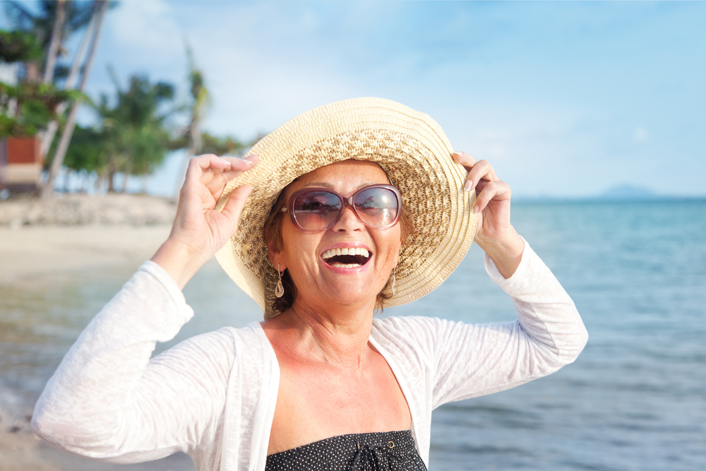 happy mature woman on the beach