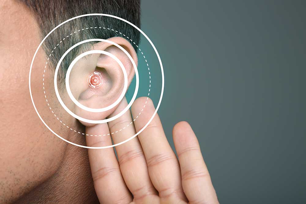 man holding ear